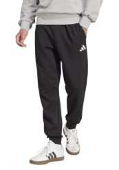 Spodnie męskie adidas Essentials Feelcozy. Czarne spodnie materiałowe męskie Adidas, bez wzorów, z bawełny, klasyczne, z standardowym stanem. Za 232.00 zł.