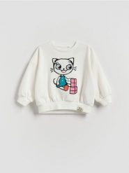 Bawełniana bluza Kicia Kocia - złamana biel. Bluzy i bluzki niemowlęce Reserved, bez wzorów, z bawełny, bez ramiączek, bez kaptura. Za 55.99 zł.