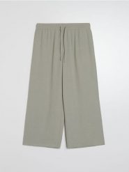 Spodnie culotte z kieszeniami - zielony. Zielone spodnie materiałowe damskie Sinsay, bez wzorów. Za 39.99 zł.