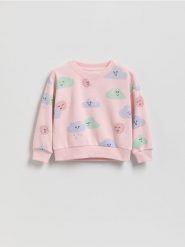 Wzorzysta bluza - pastelowy róż. Czerwone bluzy i bluzki niemowlęce Reserved, bez wzorów, z bawełny, bez ramiączek, bez kaptura. Za 45.99 zł.