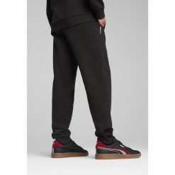 Męskie spodnie PUMATECH PUMA Black. Czarne spodnie sportowe męskie Puma, z dresówki. W wyprzedaży za 134.00 zł.