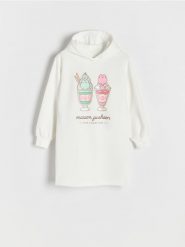 Sukienka z pachnącym nadrukiem Pusheen - złamana biel. Sukienki dziewczęce Reserved, bez wzorów, z bawełny, bez ramiączek. W wyprzedaży za 49.99 zł.