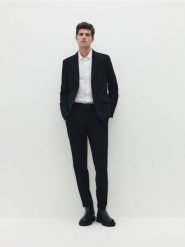 Garniturowe spodnie slim fit - czarny. Czarne spodnie wizytowe męskie Reserved. W wyprzedaży za 99.99 zł.