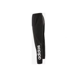 Spodnie Gym & Pilates Linear 100 męskie. Czarne spodnie materiałowe męskie Adidas, bez wzorów, z bawełny. Za 149.99 zł.