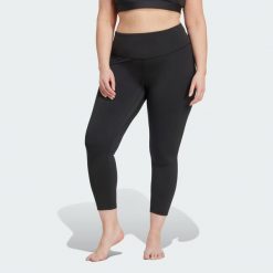 Legginsy All Me 7/8 (Plus Size). Czarne legginsy damskie Adidas, plus size, bez wzorów, z materiału. Za 279.00 zł.