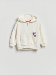 Bawełniana bluza z kapturem - złamana biel. Bluzy i bluzki niemowlęce Reserved, bez wzorów, z bawełny, bez ramiączek, z kapturem. Za 59.99 zł.