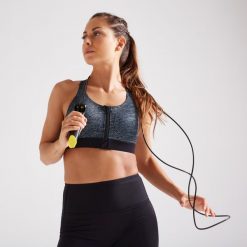 Stanik fitness cardio ZIP 900. Czarne biustonosze sportowe damskie DOMYOS, bez wzorów, z materiału. Za 79.99 zł.