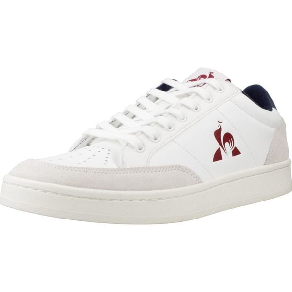 Buty LE COQ SPORTIF COURTNET Biały. Białe buty trekkingowe męskie Le Coq Sportif, ze skóry, bez zapięcia, trekkingowe. Za 313.99 zł.