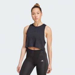 Koszulka Yoga Essentials Cropped. Czarne bluzki sportowe damskie Adidas, bez wzorów, bez kołnierzyka. Za 129.00 zł.
