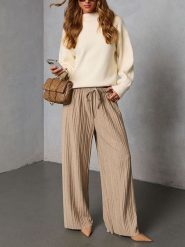 Milan Kiss Spodnie w kolorze beżowym rozmiar: L. Brązowe spodnie materiałowe damskie Milan Kiss, bez wzorów, z materiału, z podwyższonym stanem. Za 173.99 zł.