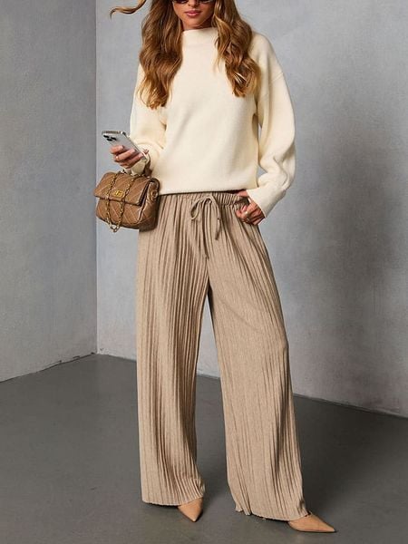 Milan Kiss Spodnie w kolorze beżowym rozmiar: L. Brązowe spodnie materiałowe damskie Milan Kiss, bez wzorów, z materiału, z podwyższonym stanem. Za 173.99 zł.