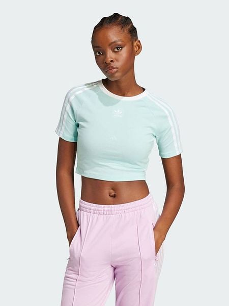 Adidas Koszulka w kolorze turkusowym rozmiar: XL. Niebieskie bluzki damskie Adidas, xl, bez wzorów, bez kołnierzyka. Za 94.95 zł.