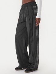 Adidas Spodnie dresowe Pearl Firebird KC7863 Czarny Loose Fit. Czarne spodnie dresowe damskie Adidas, xs, bez wzorów, z dresówki. Za 348.99 zł.