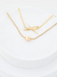 Bransoletki z błyszczącym wykończeniem 2 pack - złoty. Żółte bransoletki damskie Sinsay, złote. Za 9.99 zł.