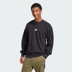 Bluza polarowa Essentials Feelcozy. Białe bluzy bez kaptura męskie Adidas, xs, z materiału. Za 179.00 zł.