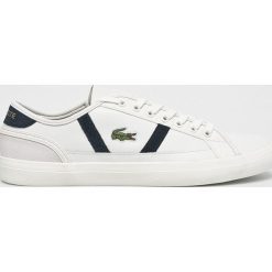 Lacoste - Buty. Białe buty sportowe na co dzień męskie Lacoste, z materiału, bez zapięcia. W wyprzedaży za 299.90 zł.