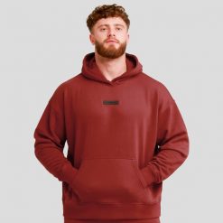 Bluza męska z kapturem oversize czerwona Unstoppable. Czerwone bluzy sportowe męskie GYMBEAM, bez wzorów, z bawełny, sportowe, bez kołnierzyka, bez ramiączek. Za 118.90 zł.