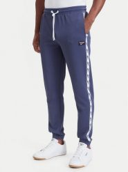 Reebok Spodnie dresowe Jacek RK25723CCM Granatowy Regular Fit. Niebieskie spodnie dresowe męskie Reebok, bez wzorów, z dresówki. Za 259.99 zł.