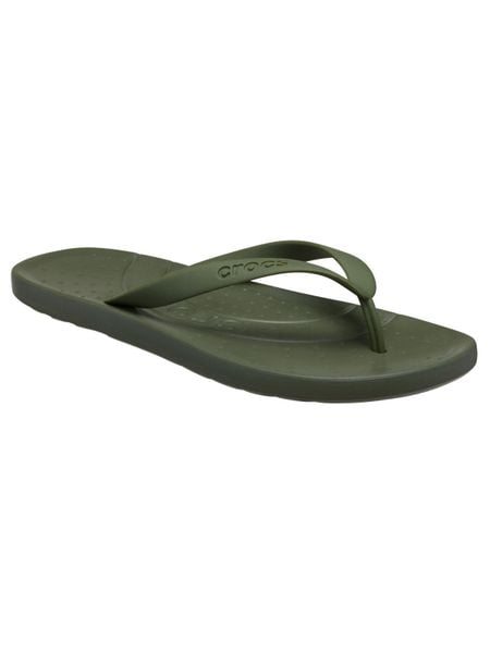 Kapcie Crocs Klapki Crocs Dorosłych. Zielone klapki damskie Crocs, bez wzorów, z materiału, bez obcasa. Za 119.99 zł.