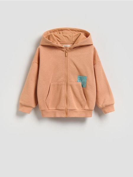 Bawełniana bluza z kapturem - pomarańczowy. Brązowe bluzy i bluzki niemowlęce Reserved, bez wzorów, z bawełny, bez ramiączek, z kapturem. Za 49.99 zł.