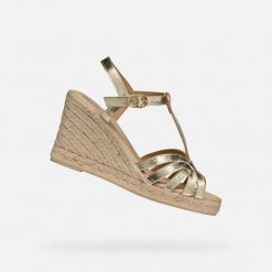 Sandały GEOX D GELSA Złoty. Żółte sandały damskie Geox, bez wzorów, ze skóry, bez obcasa. Za 437.99 zł.