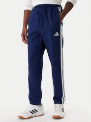 Adidas Spodnie dresowe Essentials 3-Stripes JE6334 Granatowy Regular Fit. Niebieskie spodnie dresowe męskie Adidas, bez wzorów, z bawełny. Za 219.99 zł.