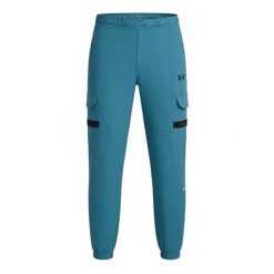 Męskie spodnie sportowe Under Armour UA Tech Utility Woven Pant. Niebieskie spodnie sportowe męskie Under Armour, z materiału. Za 349.20 zł.