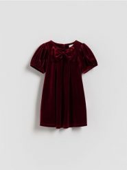 Welurowa sukienka z kokardą - czerwony. Czerwone sukienki dziewczęce Reserved, bez wzorów, z dzianiny, bez ramiączek. Za 69.99 zł.