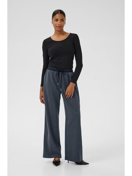 Kaffe Spodnie w kolorze niebieskim rozmiar: 42. Niebieskie spodnie materiałowe damskie Kaffe, bez wzorów, z materiału, z podwyższonym stanem. Za 157.35 zł.