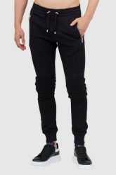 BALMAIN Dresowe spodnie męskie z wypukłym logo. Czarne spodnie dresowe męskie Balmain, bez wzorów, z bawełny. W wyprzedaży za 2,199.99 zł.