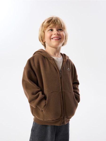 Bluza z bawełną - brązowy. Brązowe bluzy i bluzki niemowlęce Reserved, bez wzorów, z bawełny, bez ramiączek, bez kaptura. Za 49.99 zł.