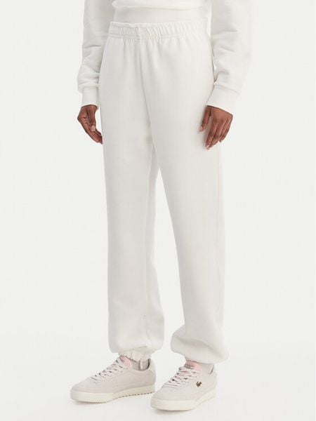 Lacoste Spodnie dresowe XF5244 Écru Regular Fit. Spodnie dresowe damskie Lacoste, bez wzorów, z bawełny. Za 609.99 zł.