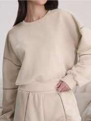Bluza z ażurowymi detalami - kremowy. Białe bluzy bez kaptura damskie Sinsay, l. W wyprzedaży za 24.99 zł.