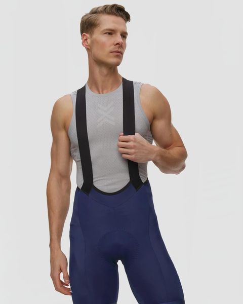 Spodenki rowerowe męskie X-Bionic Corefusion Ride Bib Shorts A095. Niebieskie szorty męskie X BIONIC, bez wzorów, klasyczne. Za 929.99 zł.