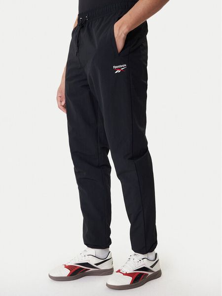 Reebok Spodnie dresowe Barrett RK25552CCM Czarny Regular Fit. Czarne spodnie dresowe męskie Reebok, bez wzorów, z dresówki. Za 299.99 zł.