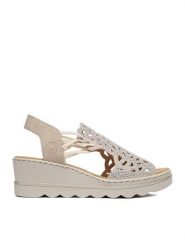 Rieker Sandały CEO-67465-62 Beżowy. Brązowe sandały damskie Rieker, bez wzorów, ze skóry, bez obcasa, na koturnie. Za 319.99 zł.