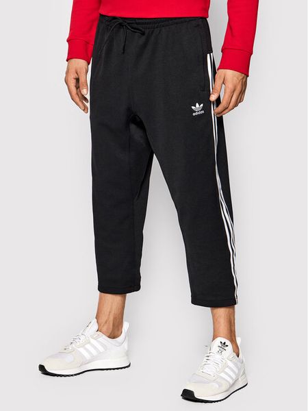 Adidas Spodnie dresowe adicolor Classics H09121 Czarny Relaxed Fit. Czarne spodnie dresowe męskie Adidas, bez wzorów, z bawełny. Za 179.99 zł.