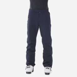 Spodnie narciarskie męskie Wedze 900. Niebieskie spodnie materiałowe męskie WED'ZE, bez wzorów, z materiału, sportowe. W wyprzedaży za 399.99 zł.