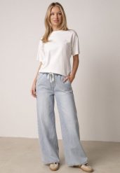 Niebieskie Jeansy z Lyocellem i Bawełną o Szerokim Kroju z Wiązaniem Zolia. Niebieskie jeansy damskie Born2be. Za 129.99 zł.