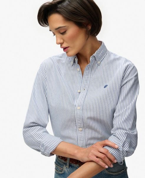 Superdry Damska koszula Oxford slim z długim rękawem – AZURE BLUE STRIPE OXFORD. Niebieskie koszule damskie Superdry., bez wzorów, z bawełny, bez kołnierzyka, bez ramiączek. Za 313.80 zł.