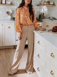 Milan Kiss Bluzka w kolorze żółto-białym rozmiar: L. Białe bluzki damskie Milan Kiss, l, bez wzorów, bez kołnierzyka, bez ramiączek. Za 126.99 zł.