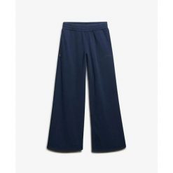 Damskie spodnie dresowe z szerokimi nogawkami Superdry Essential. Niebieskie spodnie sportowe damskie Superdry., l, z dresówki, na fitness i siłownię. Za 293.45 zł.