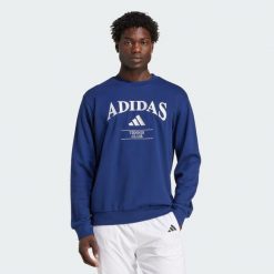 Bluza adidas Heritage Graphic Crew. Niebieskie bluzy bez kaptura męskie Adidas, s. W wyprzedaży za 180.95 zł.