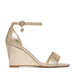 Sandały MEXX. Żółte sandały damskie Mexx, bez wzorów, bez obcasa, na koturnie. Za 299.99 zł.