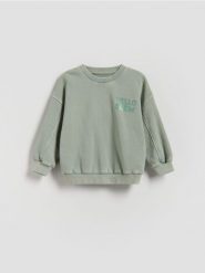 Bluza z efektem sprania - jasnozielony. Zielone bluzy i bluzki niemowlęce Reserved, bez wzorów, z bawełny, bez ramiączek, bez kaptura. Za 45.99 zł.