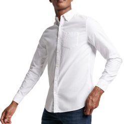 Koszula z długim rękawem z bawełny organicznej Superdry Oxford. Białe koszule męskie Superdry., xl, bez wzorów, z bawełny, bez kołnierzyka, bez ramiączek. Za 269.15 zł.