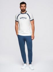 Spodnie męskie dresowe typu jogger - granatowe V4 - Rozmiar: L. Niebieskie spodnie dresowe męskie Ombre Clothing, bez wzorów, z bawełny. W wyprzedaży za 101.24 zł.