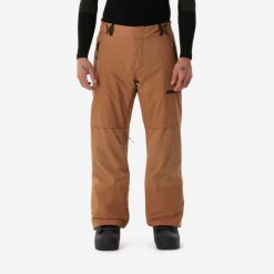 Spodnie snowboardowe męskie Dreamscape SNB 500. Brązowe spodnie materiałowe męskie DREAMSCAPE, bez wzorów, z materiału, sportowe. Za 449.99 zł.