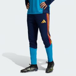 Spodnie Spain 26 Tiro Training. Niebieskie spodnie dresowe męskie Adidas, bez wzorów, z dresówki. Za 279.00 zł.