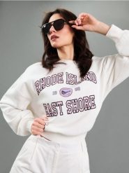 Bluza dresowa z haftowanym napisem - kremowy. Białe bluzy bez kaptura damskie Sinsay, l, z dresówki. Za 39.99 zł.